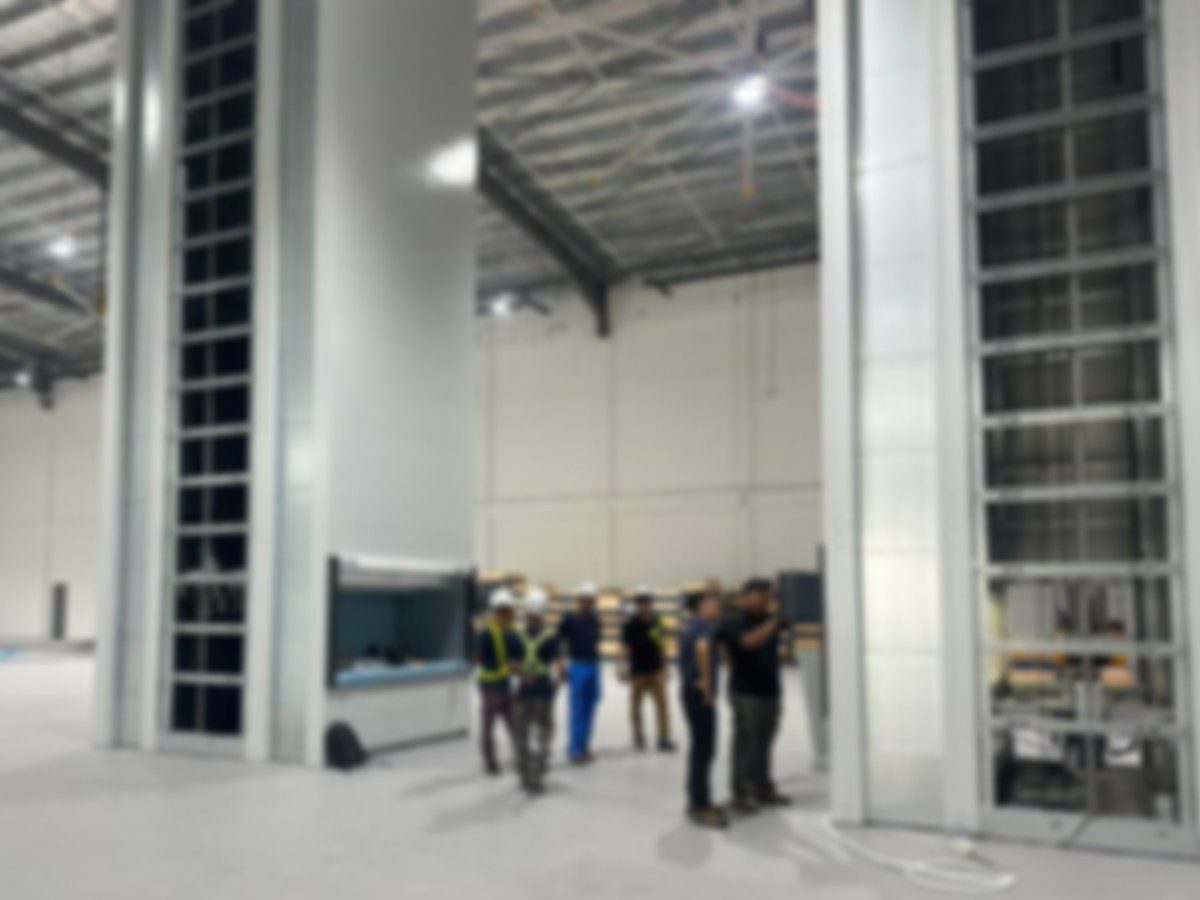 Heavy equipment installation inside clean booth
